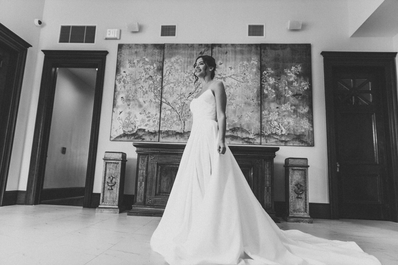 Bride standing in the lobby of the 1908 Grand located in Gainesville, Florida
