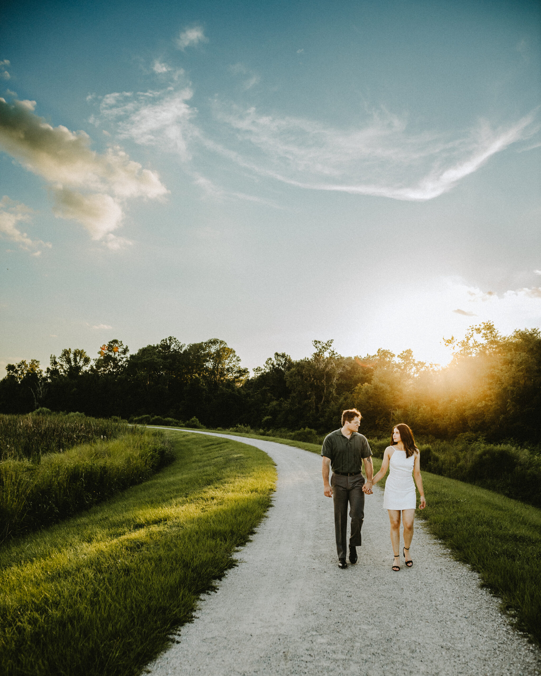 Bride and Groom Walking at Sweetwater Wetlands at Sunset on their Wedding Day